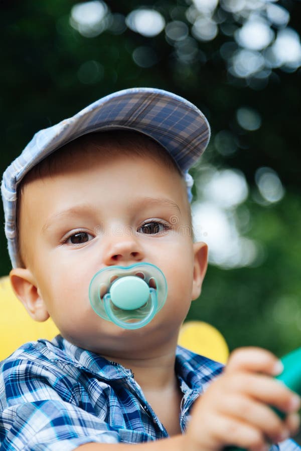 Portrait of a pretty baby with pacifier