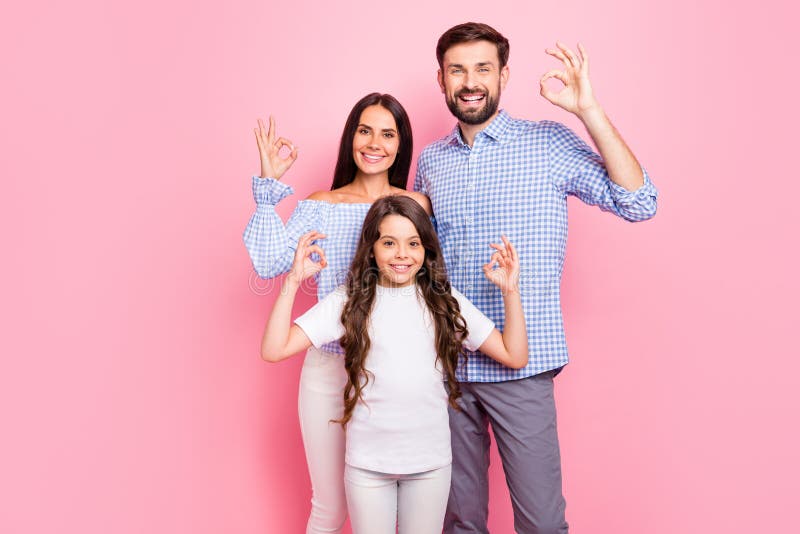 Portrait of pretty father mother kid making okay signs smiling wearing white t-shirt checkered plaid shirt blouse stock photography Portrait of pretty father mother kid making okay signs smiling wearing white t-shirt checkered plaid shirt blouse stock photography