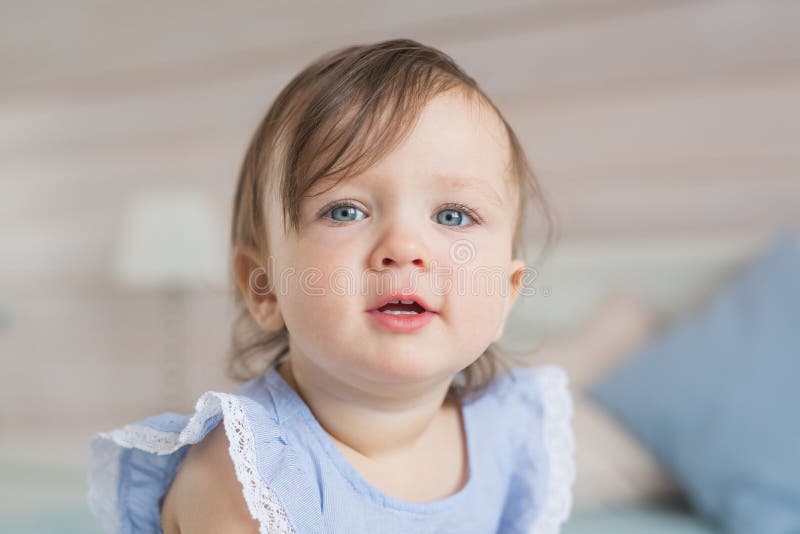Portrait Of Pretty Little Baby Girl In A Blue Dress Stock Photo Image