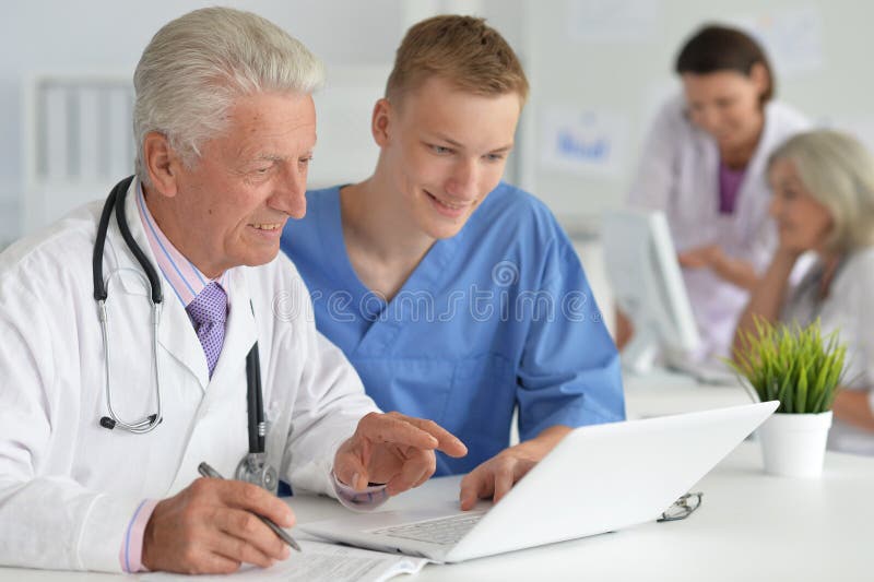 Portrait of Professional Doctors Working in Stock Photo Image