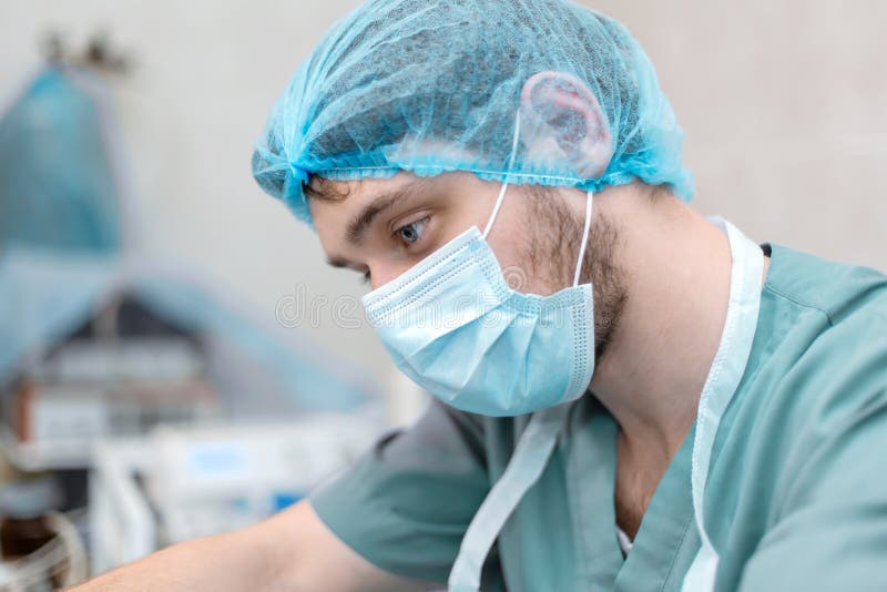Portrait of professional surgeon focused on working process stock image Portrait of professional surgeon focused on working process stock image