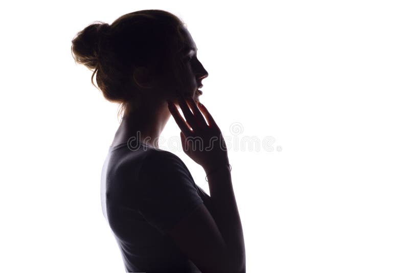 Portrait profile of beautiful girl with hand-picked hair, silhouette of a woman on a white isolated background, concept beauty and stock images Portrait profile of beautiful girl with hand-picked hair, silhouette of a woman on a white isolated background, concept beauty and stock images