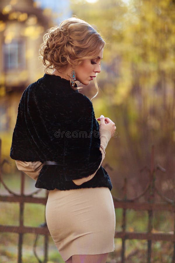 Portrait In Profile Of A Sensual Kinky Girl In Black Coat Autumn Stock Image Image Of Curly