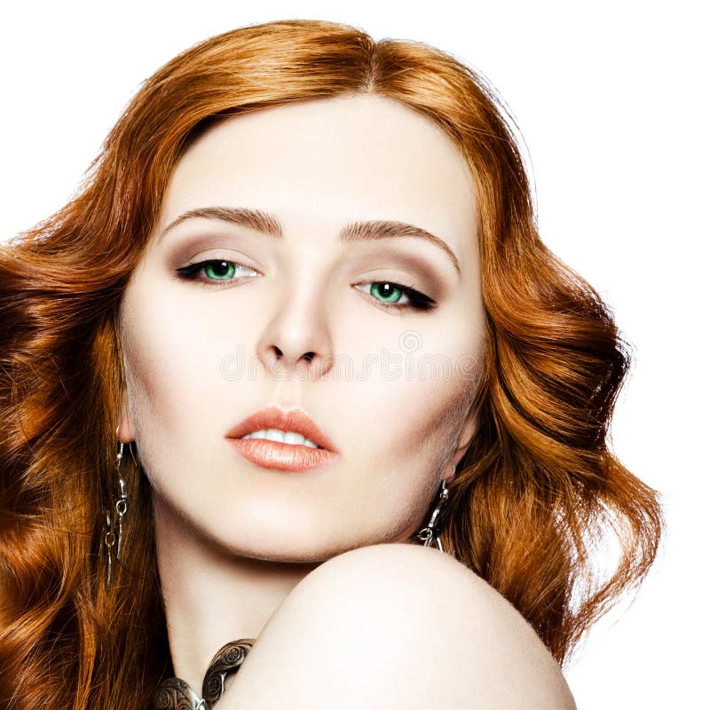 Portrait Of A Red Haired Green Eyed Girl In Jewelry With An Ethnic 