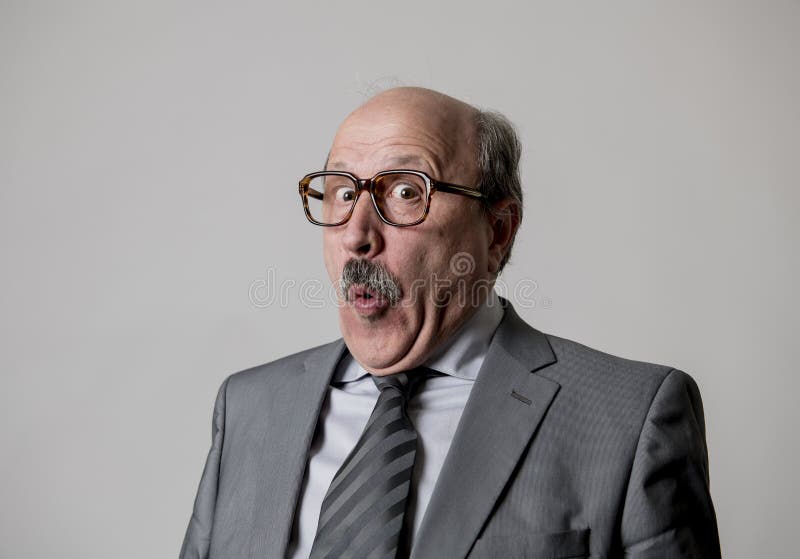 Portrait of 60s bald senior happy business man gesturing funny and comic in laughter and fun face expression looking happy