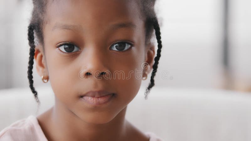 Portrait sad cute african child orphan offended afro american ethnic small girl black mixed race toddler 7 years kid