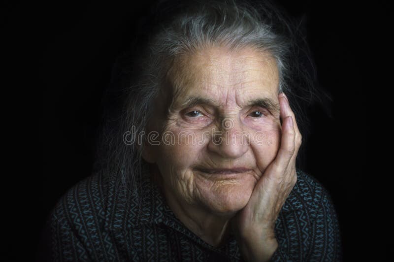 Portrait of a sad elderly woman. Dreaming the past. stock photo Portrait of a sad elderly woman. Dreaming the past. stock photo