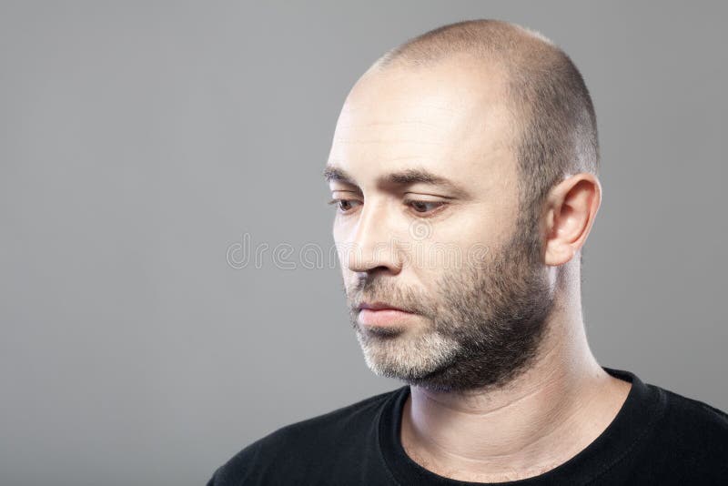 Portrait of sad mature caucasian man isolated on gray royalty free stock images