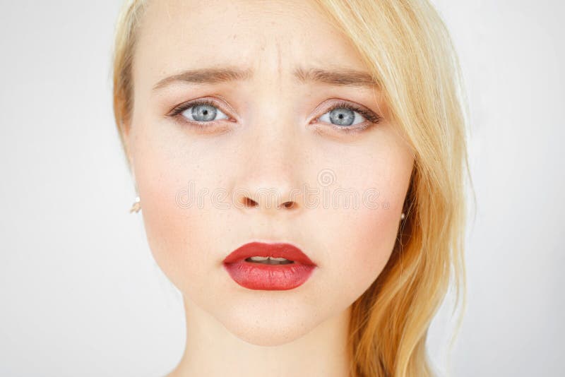 Portrait of sad red-haired woman