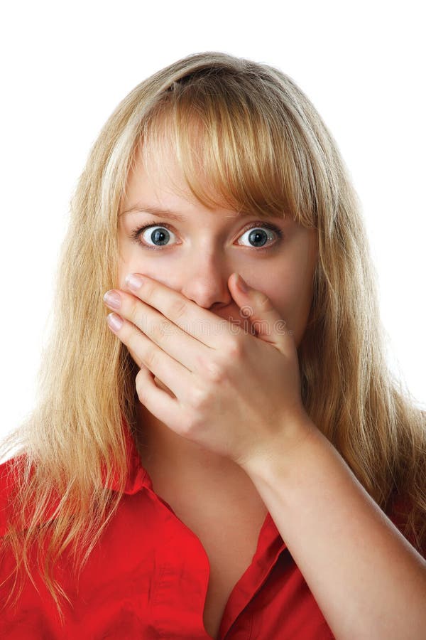 Portrait of scared woman covering mouth with hand