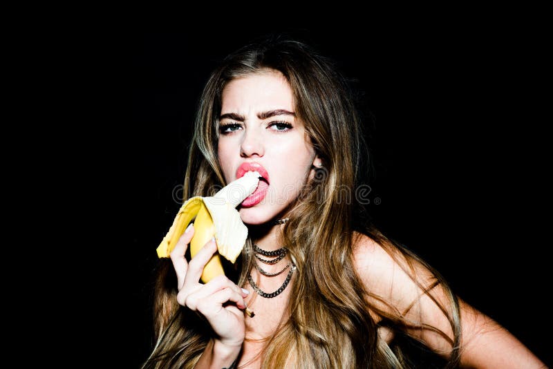 Portrait of seductive young woman eating banana. Tropical fruits. Summer concept. Healthy eating. Sexy sweet dreams. Portrait of seductive young woman eating royalty free stock images