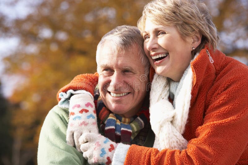 Portrait Of Senior Couple Hugging Wearing Winter Clothing