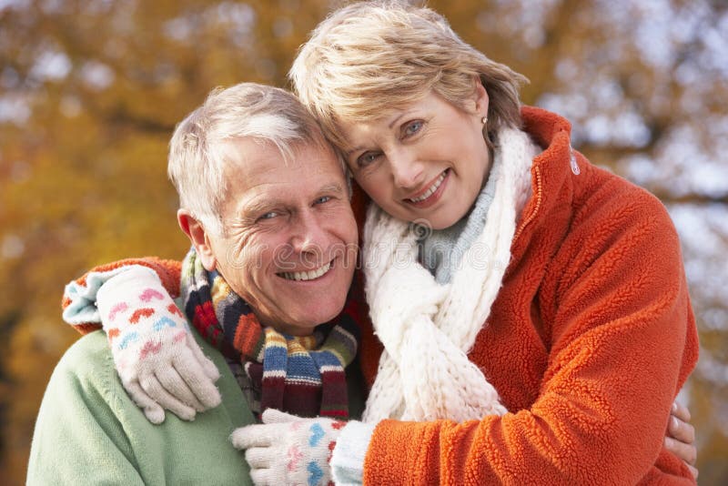 Portrait Of Senior Couple Hugging Wearing Winter Clothing