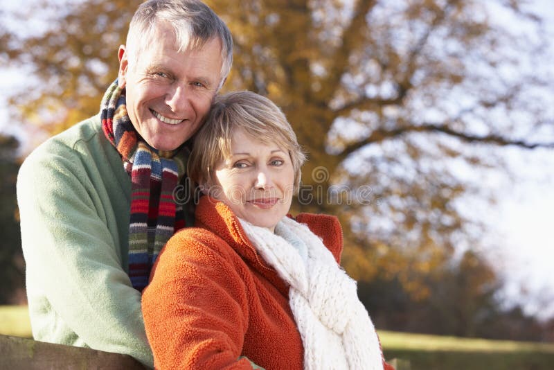 Portrait Of Senior Couple Hugging Wearing Winter Clothing