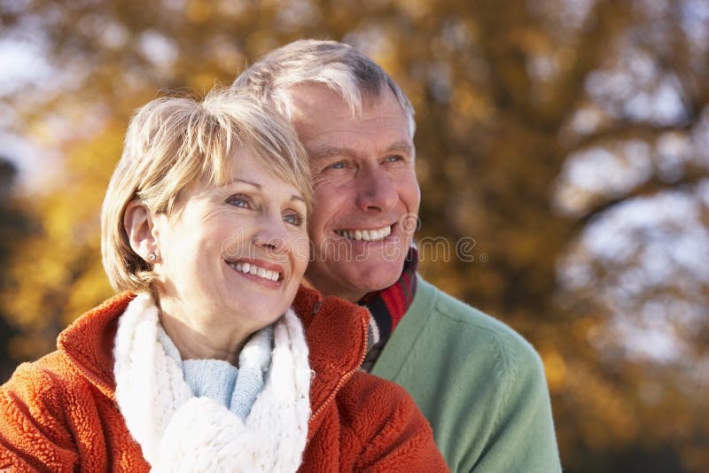 Portrait Of Senior Couple Hugging Wearing Winter Clothing