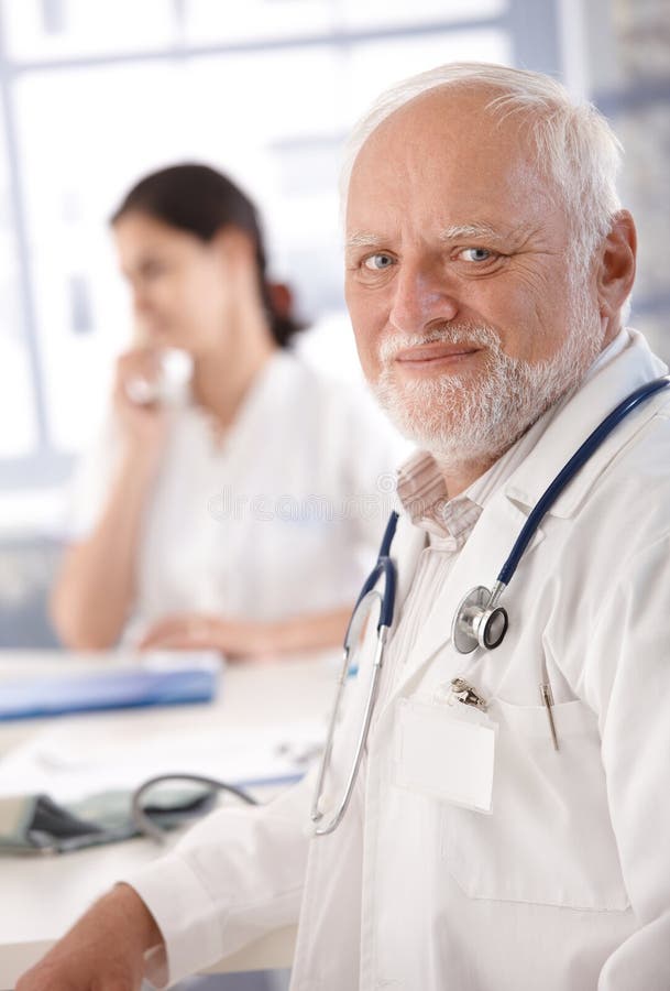 Portrait of senior doctor smiling