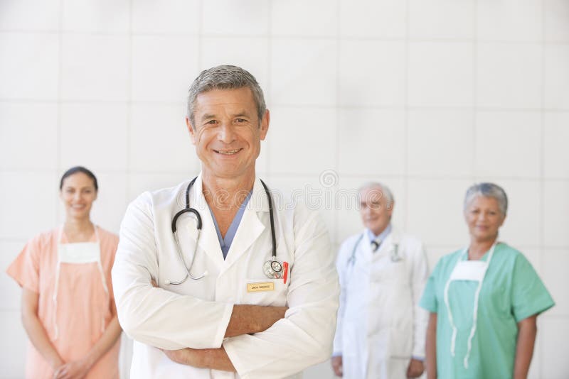 Portrait of senior doctor with staff