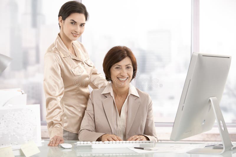 Portrait of senior executive woman with assistant royalty free stock photos Portrait of senior executive woman with assistant royalty free stock photos