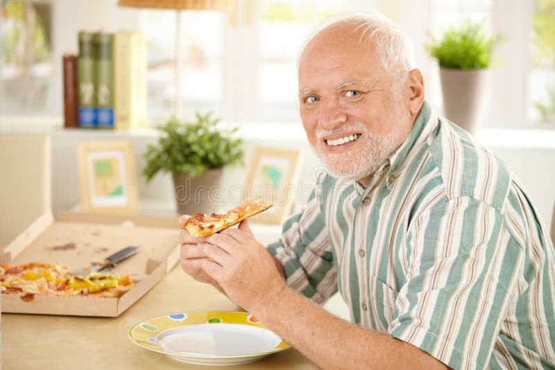 Portrait of senior having pizza royalty free stock images Portrait of senior having pizza royalty free stock images