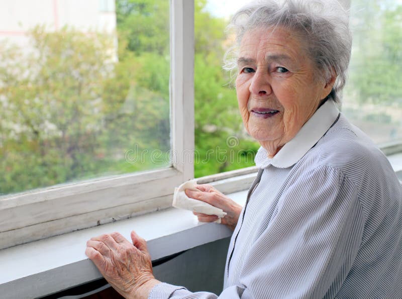 Portrait of senior woman at the window