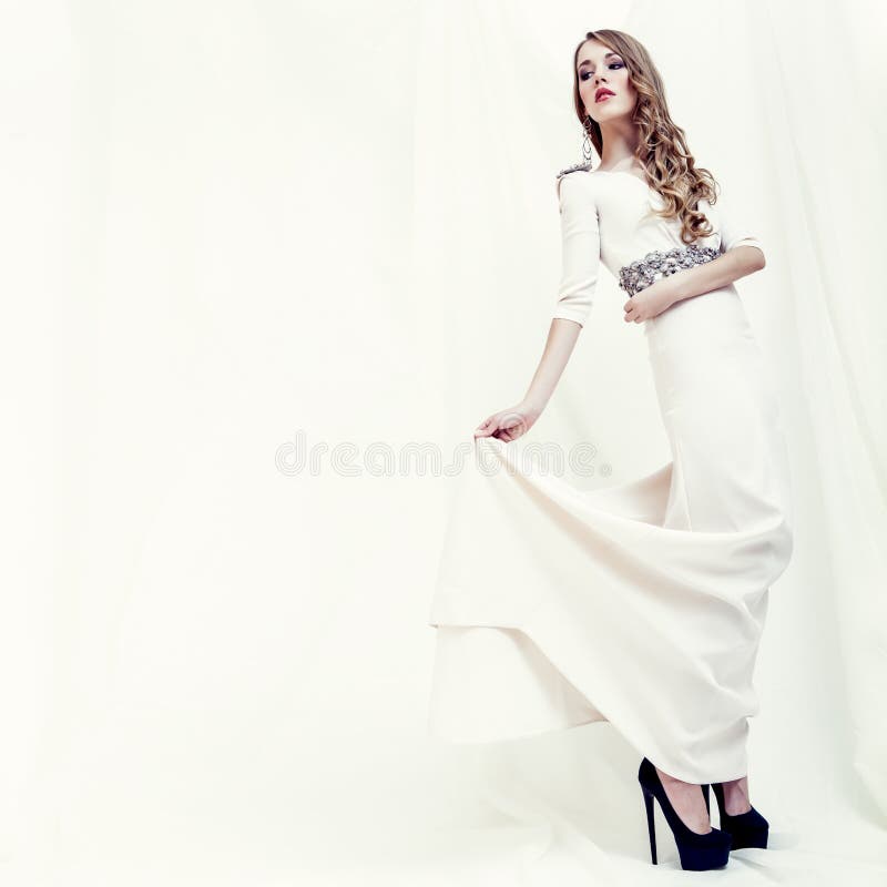 portrait of a sensual girl in a white dress