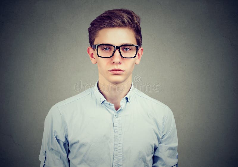 Portrait of a serious man in glasses