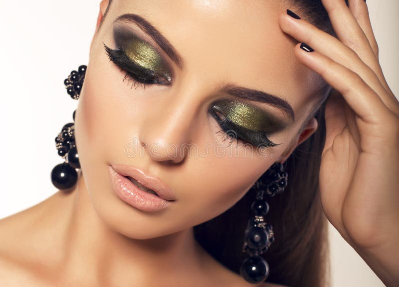 Portrait of beautiful brunette with smokey eyes makeup stock images Portrait of beautiful brunette with smokey eyes makeup stock images