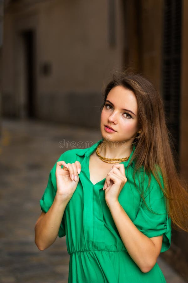 Portrait of a sexy Caucasian woman in a casual green dress