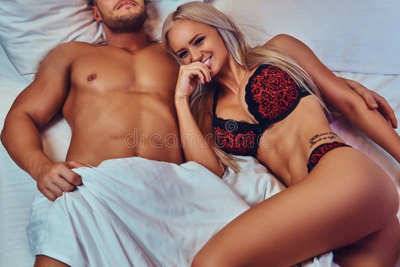 Portrait of Husband and Wife, Relaxing in Bed, Honeymoon picture image