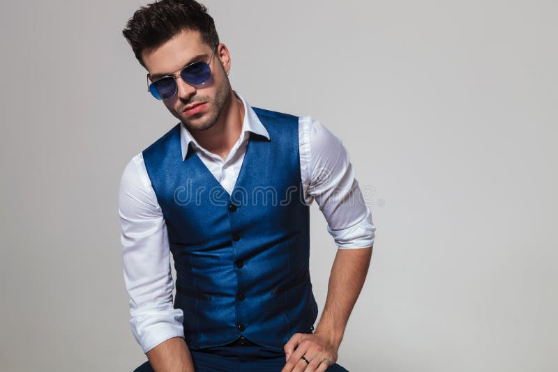 Portrait of Man Wearing a Blue Waistcoat and Sunglasses Stock Image - Image  of lean, hairstyle: 123640813