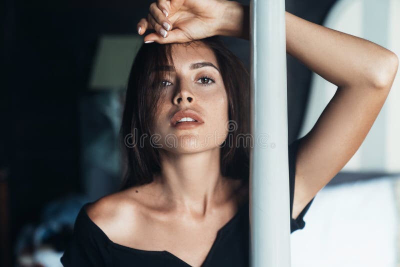 Portrait Of Sensual Girl In Swimsuit Relaxing At Beach With Big Stones On Background Stock Image 