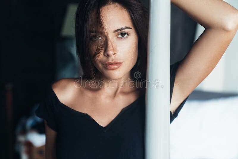 Portrait Of Sensual Girl Has Smooth Tanned Skin Posing On Beach Wind 