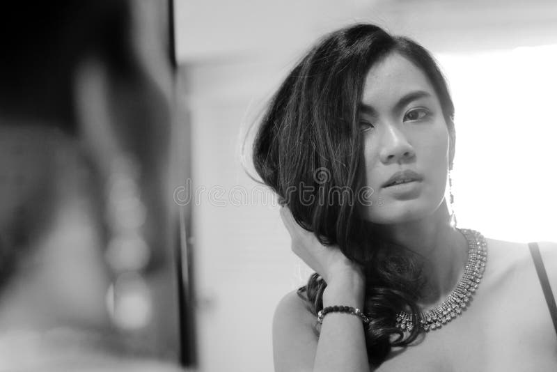 Portrait of woman with mirror, black and white pho