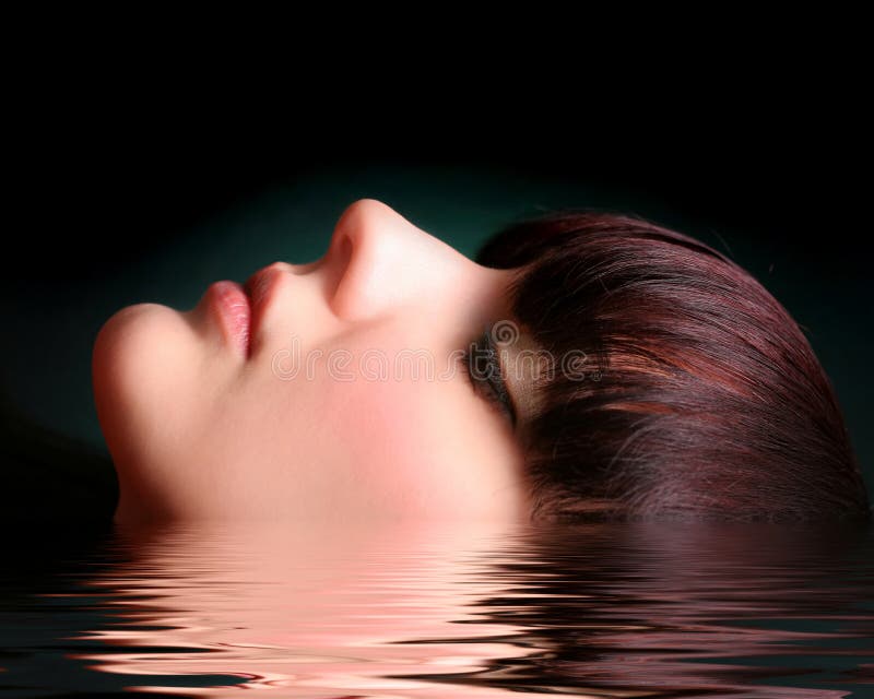 Portrait of a young woman in water