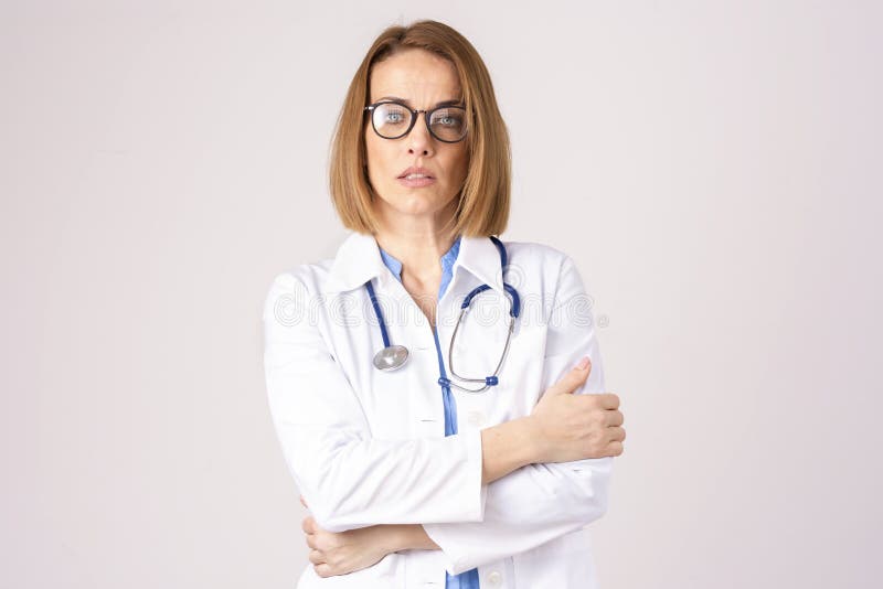 Middle aged female doctor portrait at isolated white background
