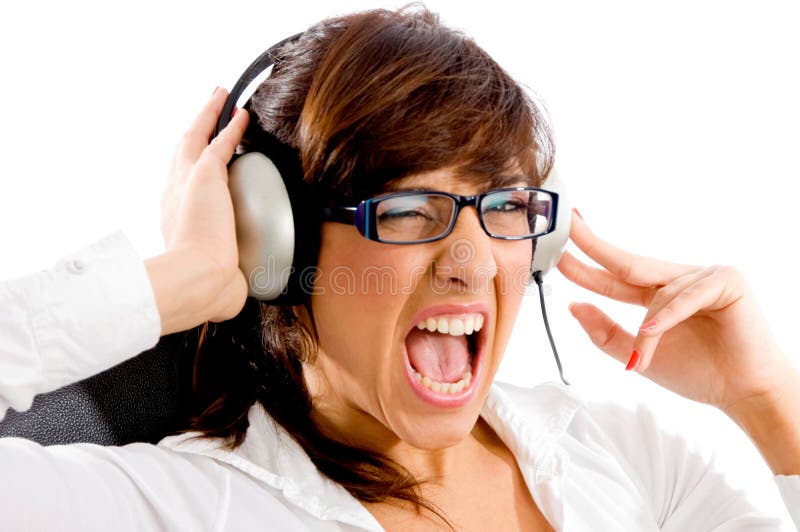 Portrait of shouting woman listening music