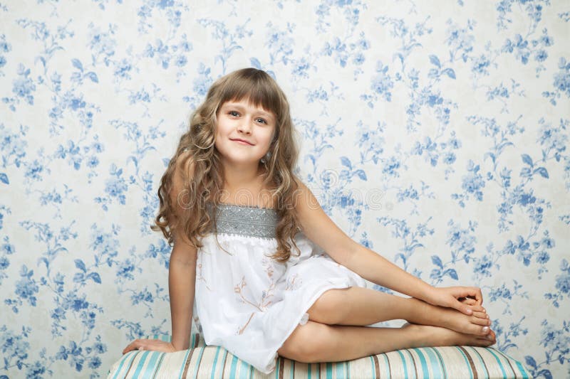 Portrait of sincere girl in sitting posture