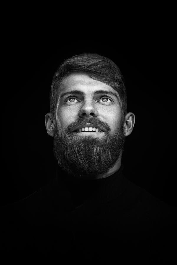 Portrait of single bearded handsome young caucasian man with big stock photos Portrait of single bearded handsome young caucasian man with big stock photos