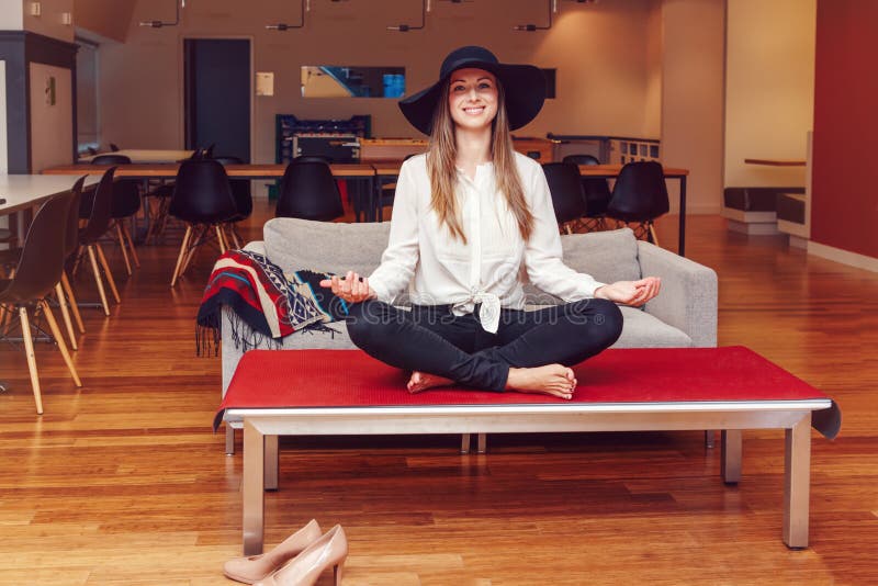 Portrait of slim fit sporty young white Caucasian business woman meditating doing yoga exercises stock image Portrait of slim fit sporty young white Caucasian business woman meditating doing yoga exercises stock image