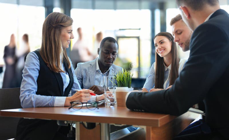 Portrait of smart business partners planning work at meeting royalty-vrije stock afbeeldingen