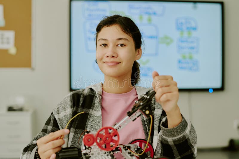 Portrait of Genius Girl with Robot royalty free stock photography