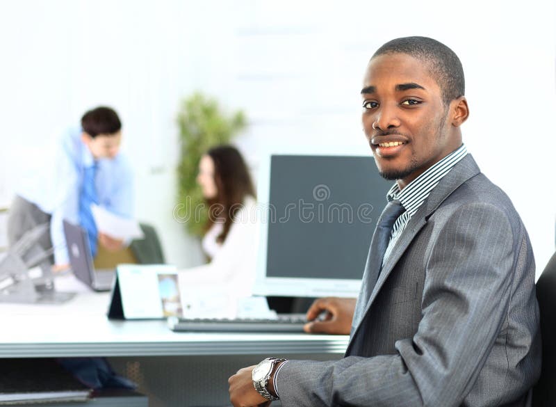 Portrait of smiling African American business man with executives