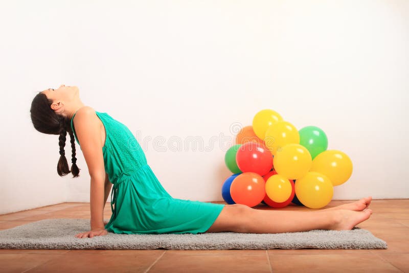 Smiling Girl Exercising Yoga - Seated Forward Fold Stock Photo - Image of  grey, dress: 168157300