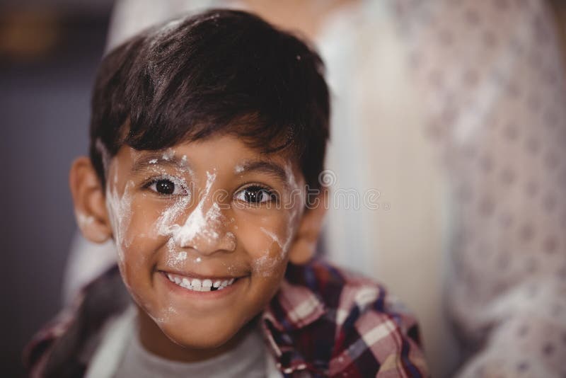 Portrait of Smiling Boy with Flour on Face Stock Photo Image of front