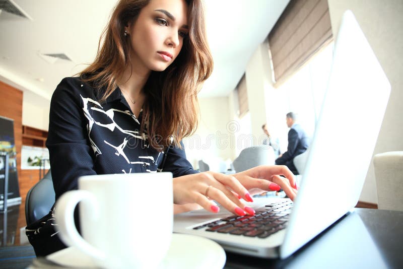 Portrait of a smiling businesswoman working in office. stock images Portrait of a smiling businesswoman working in office. stock images