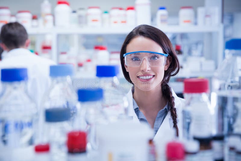 Portrait of a Smiling Chemist Wearing Safety Glasses Stock Photo
