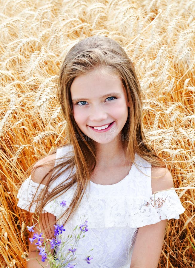 Portrait of Smiling Cute Little Girl Child on Field of Wheat Holding ...