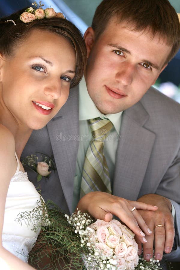 Portrait smiling groom and bride