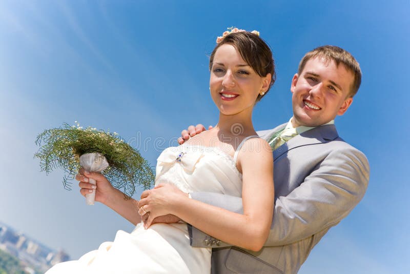 Portrait smiling groom and bride