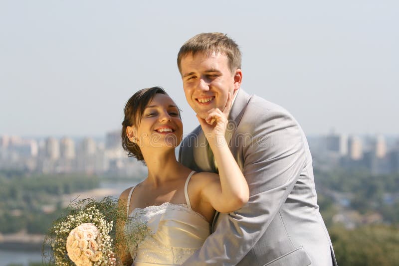 Portrait smiling groom and bride